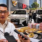 Doc. Juru Bicara KPK Budi Prasetyo memberikan keterangan terkait penyidikan dugaan korupsi pengelolaan Dana Siap Pakai (DSP) BNPB. Ilustrasi menampilkan kendaraan yang dikaitkan dengan proses penyitaan serta barang bukti berupa uang tunai, emas, dan aset kripto yang disebut dalam penanganan perkara.